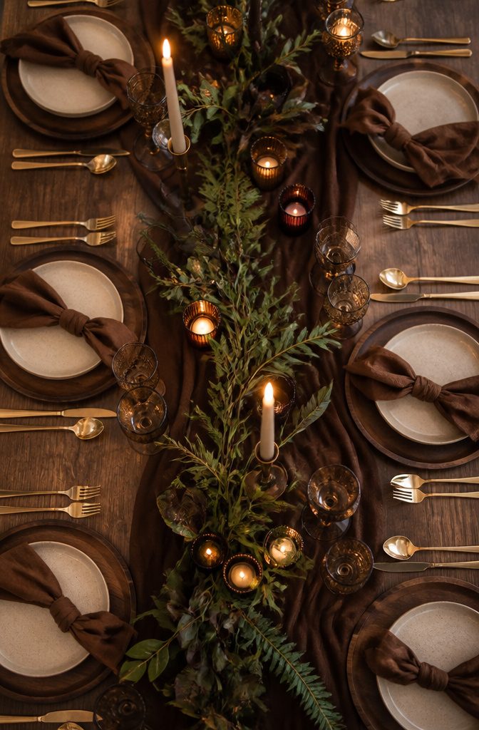 Brown Wedding Color Ideas: 2026 Palettes and Seasonal Styling 11 Reception table with chocolate brown linens and ceramic dishes.