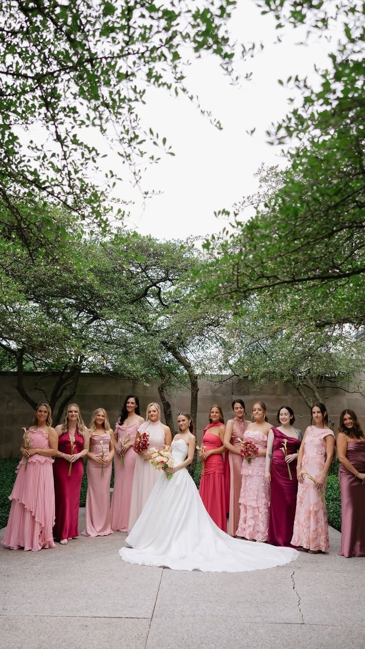 10 Burgundy and Blush Wedding Ideas for Color, Flowers & Decor 4 Bridesmaids in burgundy and blush dresses stand with a bride in a white wedding gown.