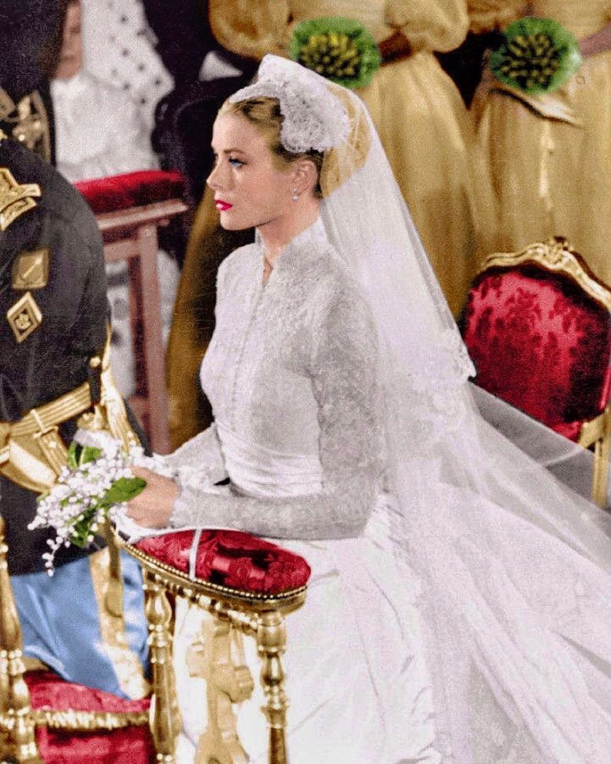 Iconic Wedding Dresses and 6 Stories They Still Tell 6 A bride in a high-necked lace wedding dress and veil sits during a formal ceremony.