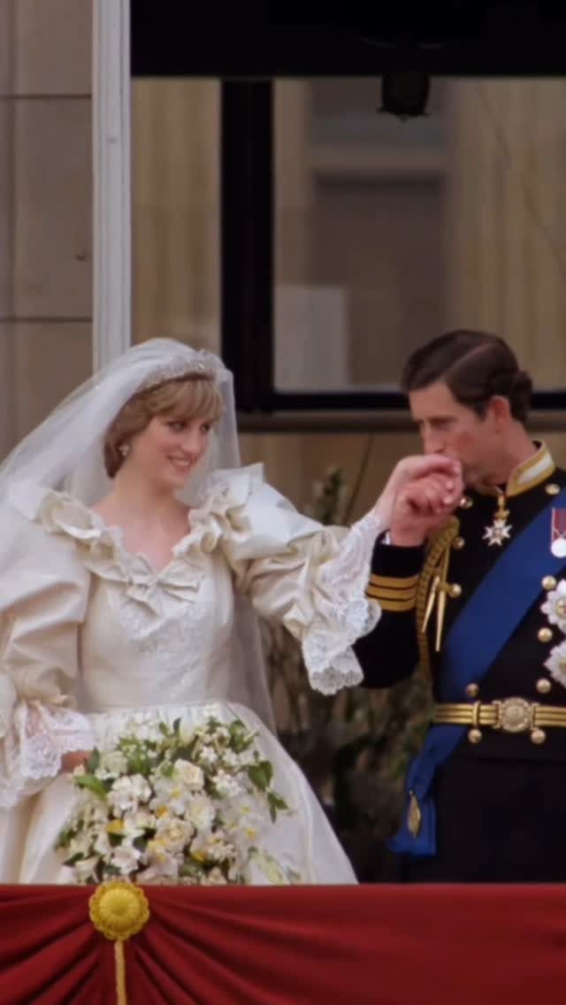 Iconic Wedding Dresses and 6 Stories They Still Tell 1 Princess Diana in her iconic ruffled wedding dress holding hands with Prince Charles on a balcony.