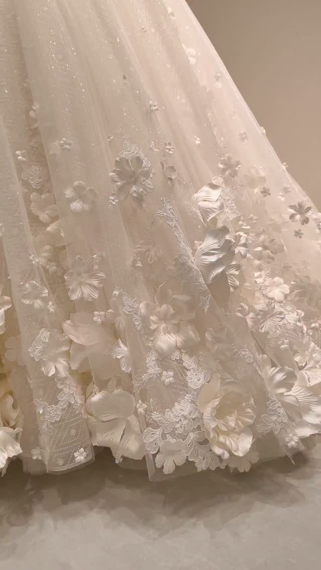 Wedding Dress Fabrics: 4 Photos of Silk, Lace, Satin and Tulle 4 Ivory wedding dress skirt with floral lace appliqués on sheer tulle fabric.